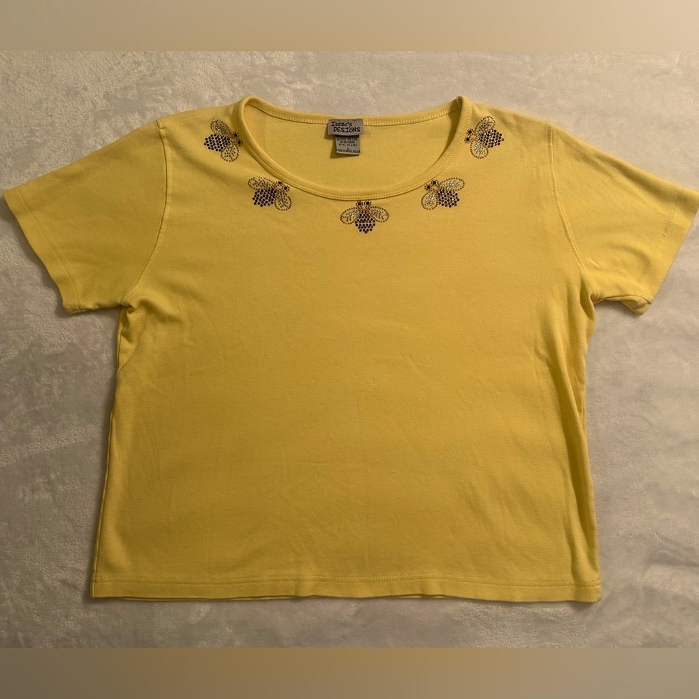 Isaac’s designs bee rhinestone detail. Women’s size large